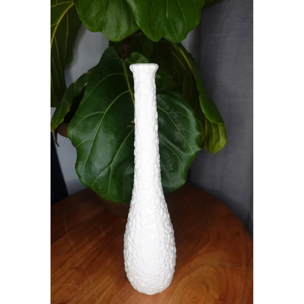White vase with long neck and‎ gourd like ribbed textured